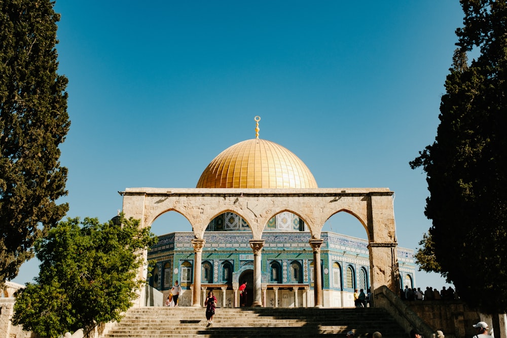 white and brown dome building under blue sky during daytime