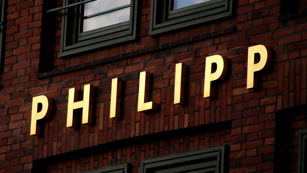 brown brick building with white and brown led light