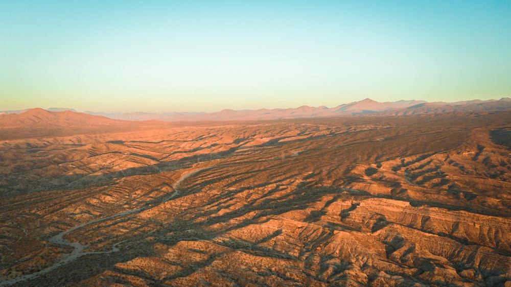 brown mountains under blue sky during daytime