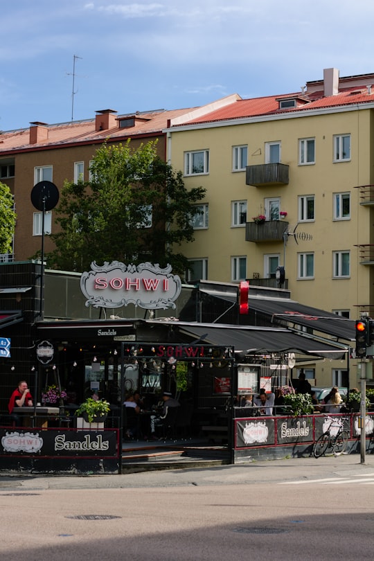 people walking on street near building during daytime in Jyväskylä Finland