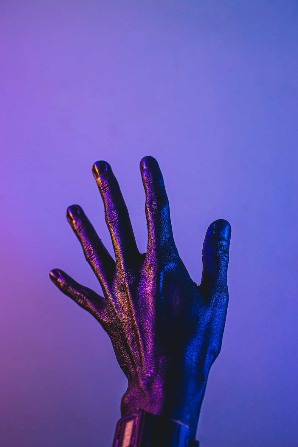 persons hand with blue paint