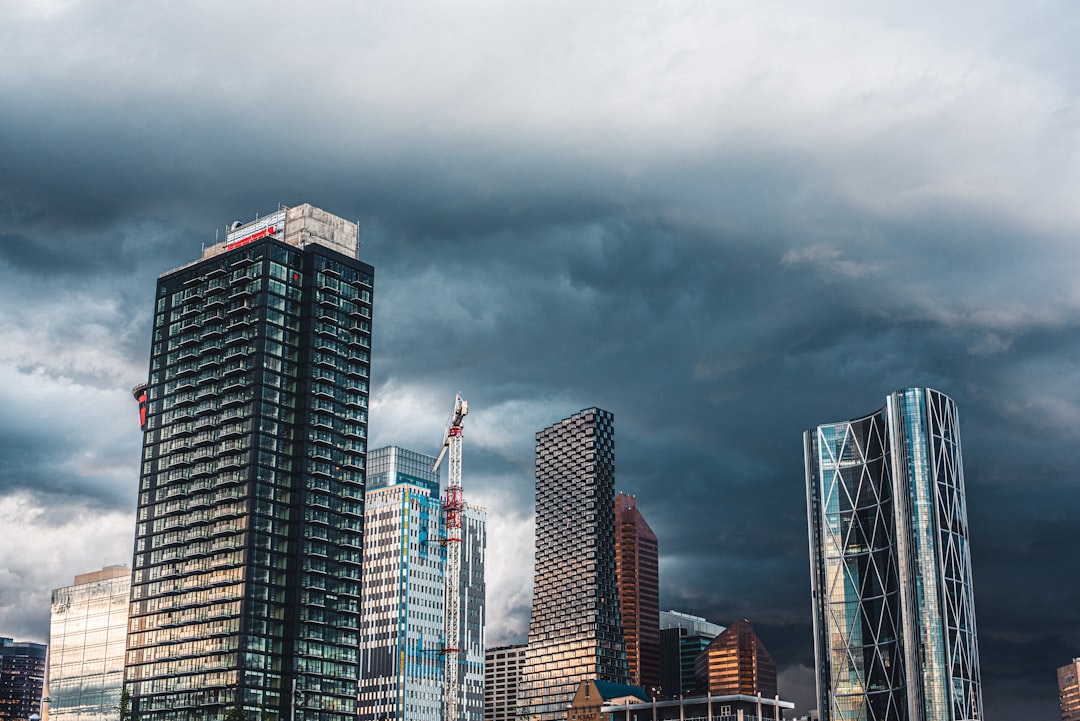 high rise buildings under gray clouds during daytime