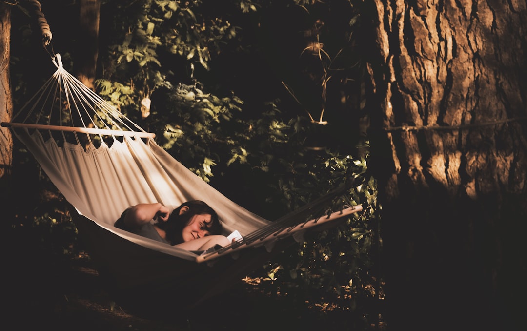 2 women lying on hammock