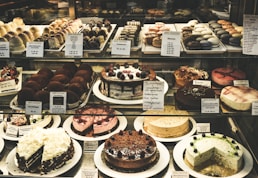 chocolate cupcakes on white wooden shelf