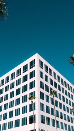 white concrete building under blue sky during daytime