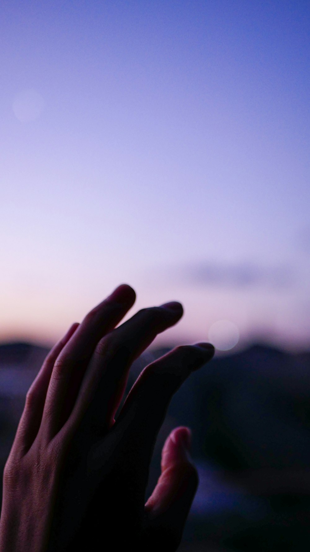 persons hand with light