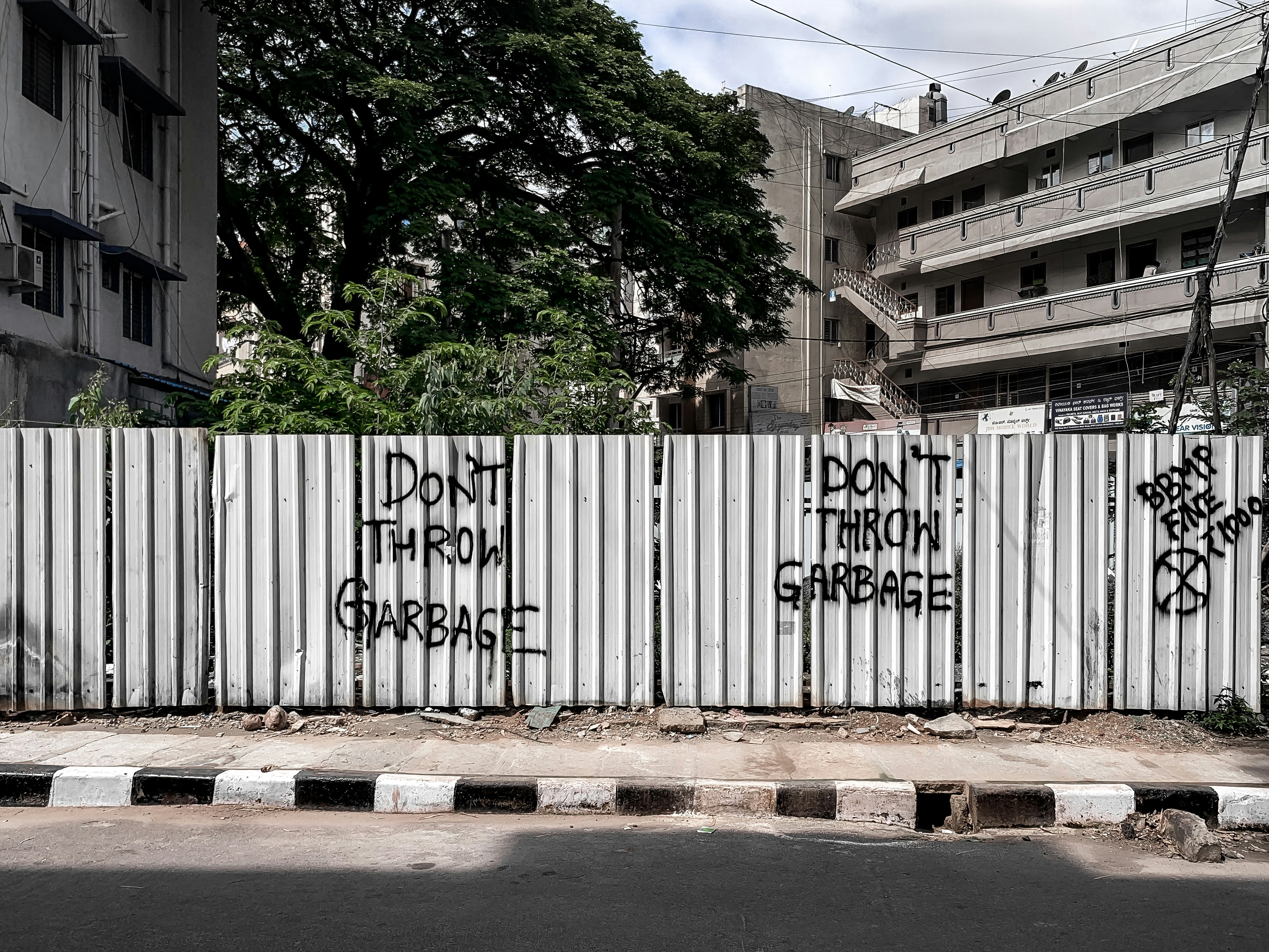 Green trees and white fence in Bengaluru