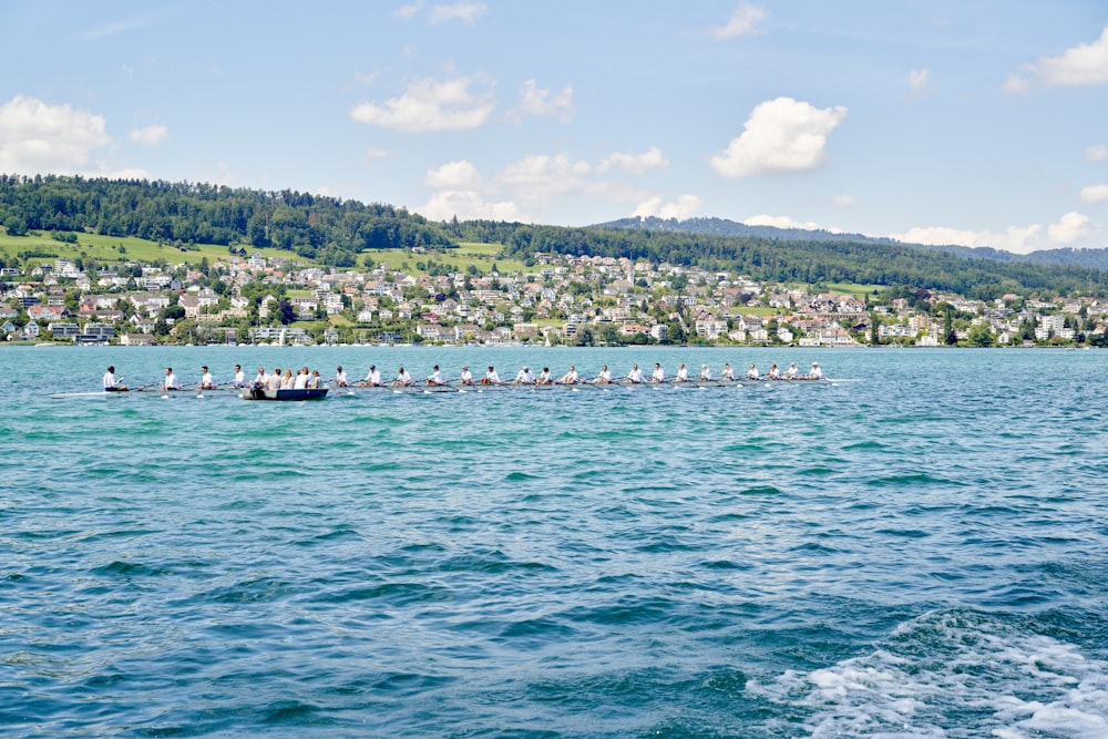 people riding on boat on sea during daytime