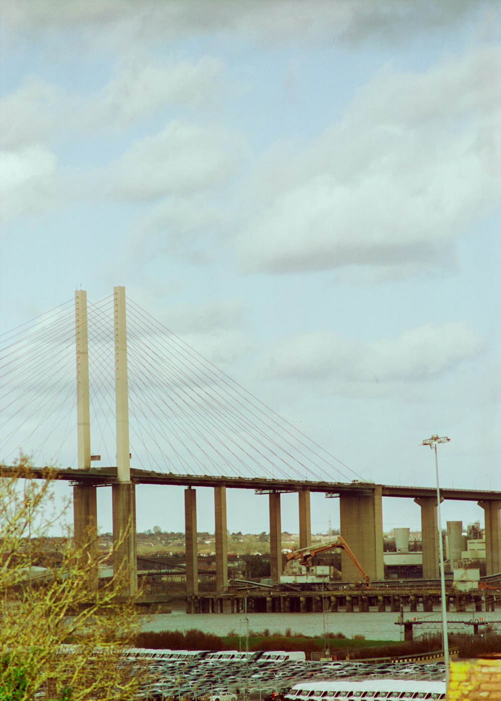 brown bridge under white clouds during daytime