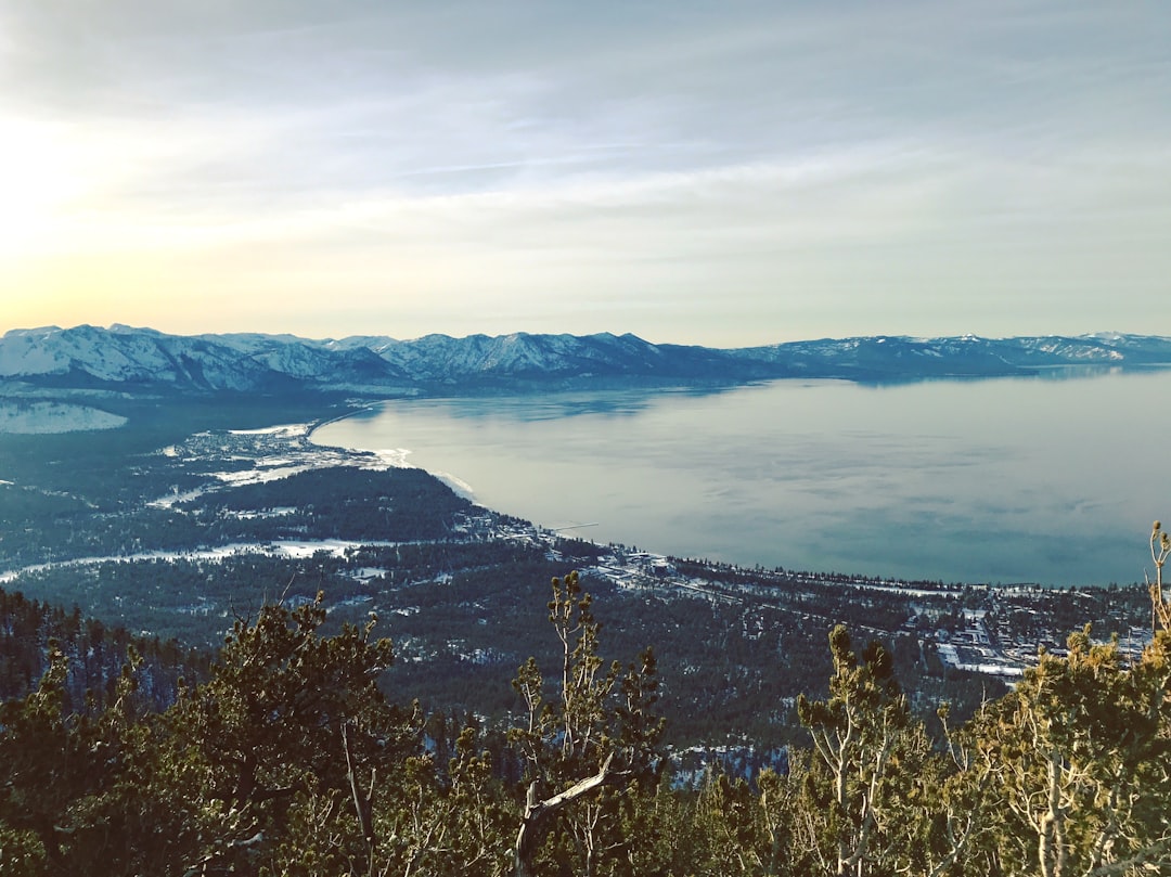 aerial view of lake and mountains during daytime