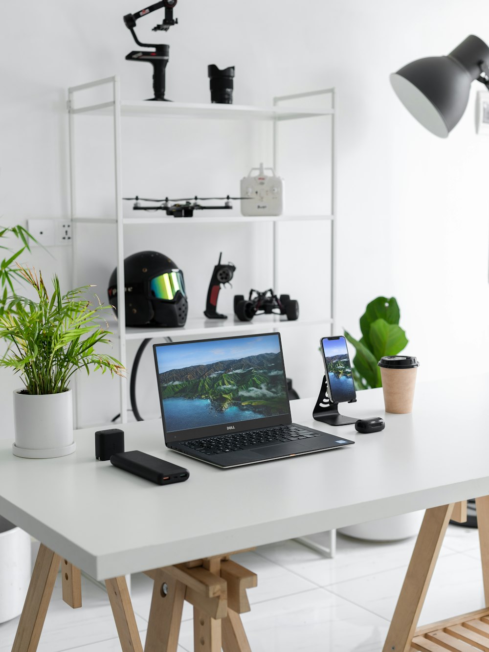 black laptop computer on white table