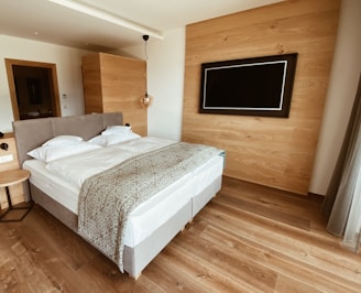 white bed linen on bed