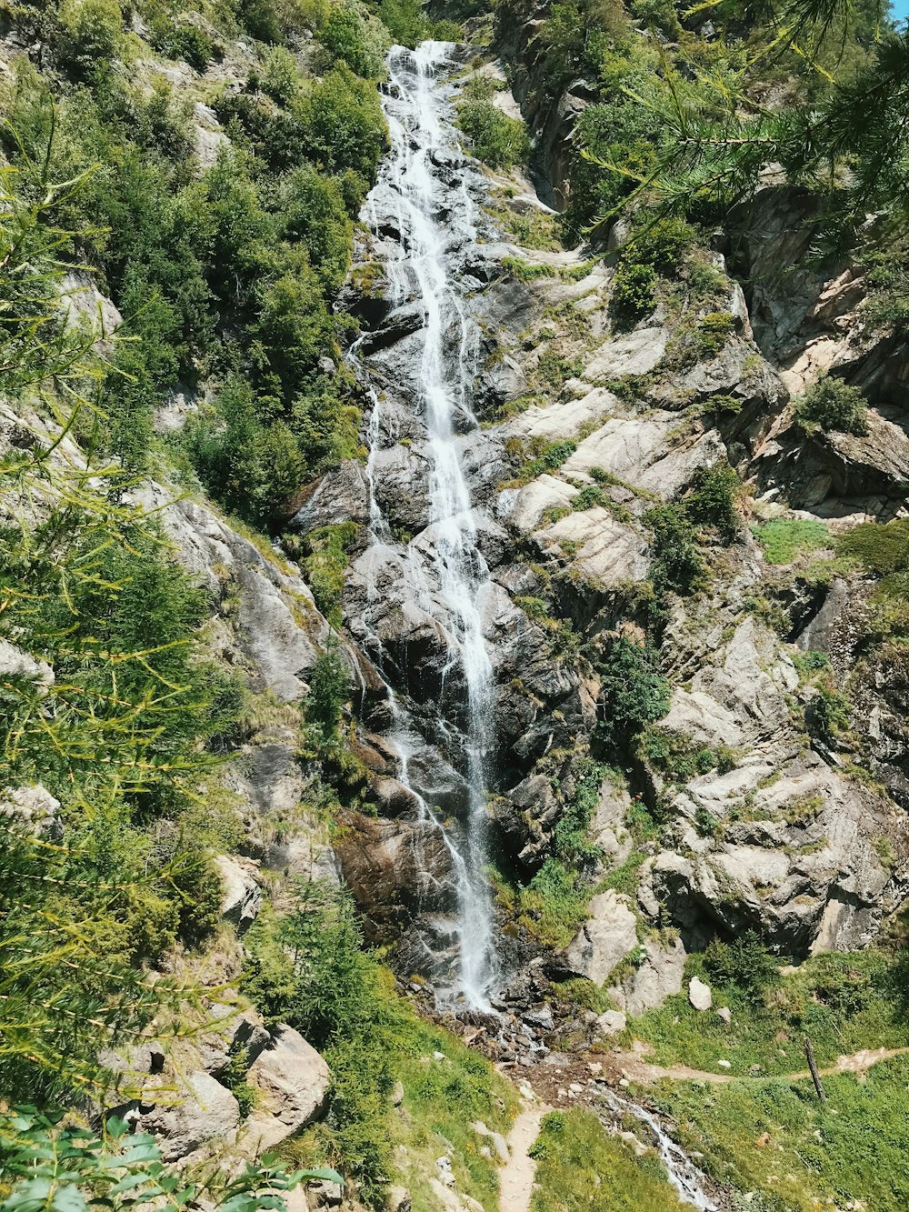 water falls on rocky mountain