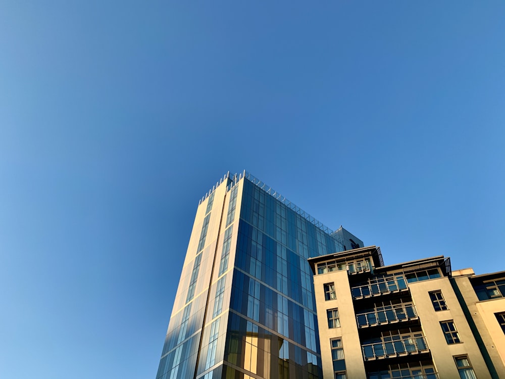 white and blue concrete building under blue sky during daytime