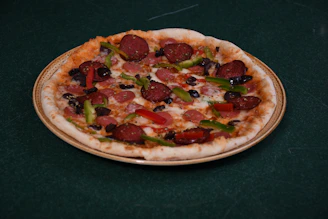 A variety of specialty pizzas with toppings like pepperoni, veggies, and cheese.
