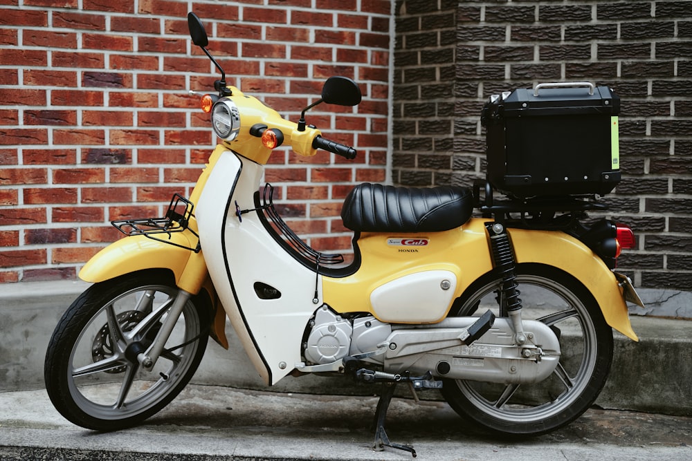 yellow and black motor scooter