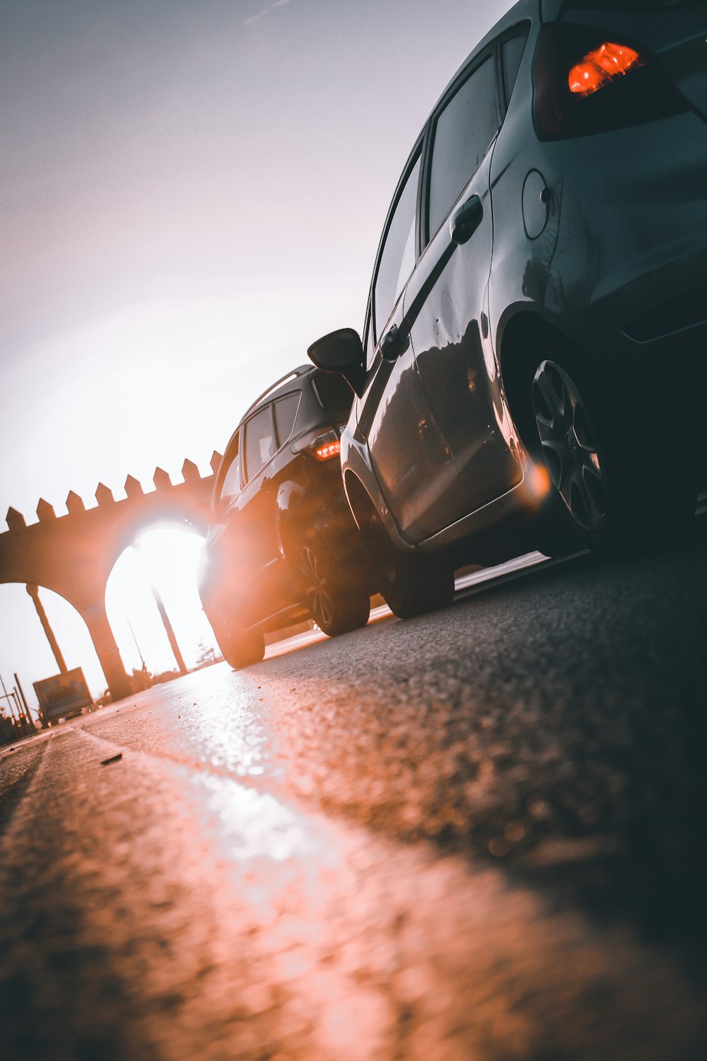 black car on gray asphalt road during daytime