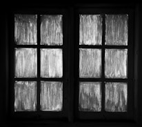 Image showing a professional measuring windows for a custom fit.