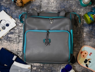 gray and black leather handbag