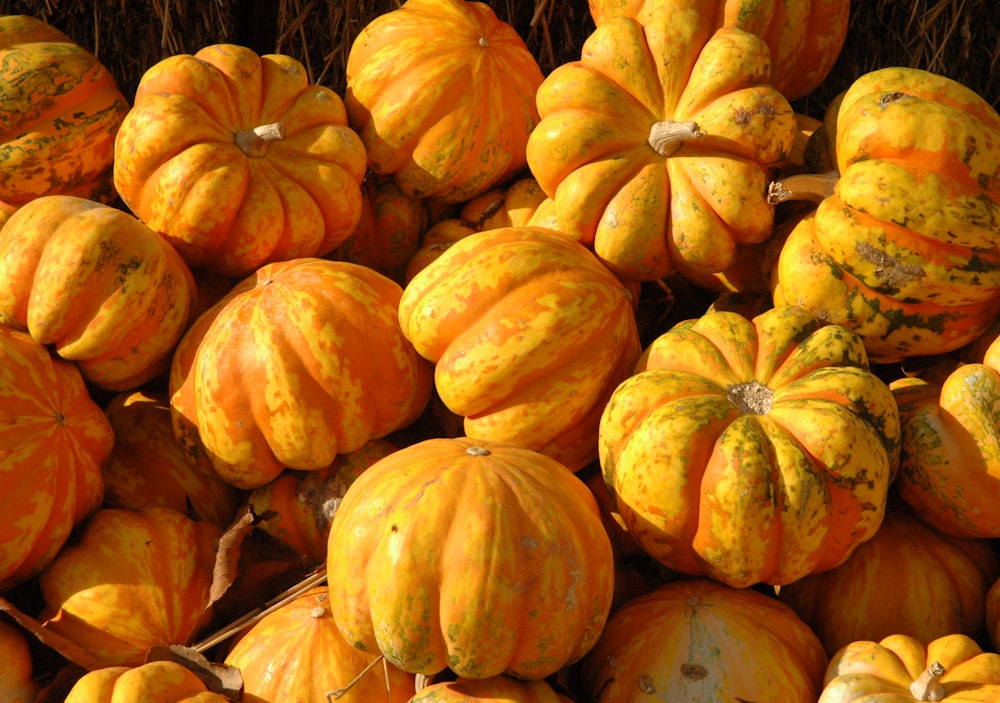 orange pumpkins on brown wooden table