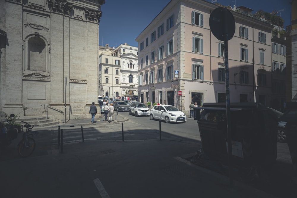 cars parked on side of road near building during daytime