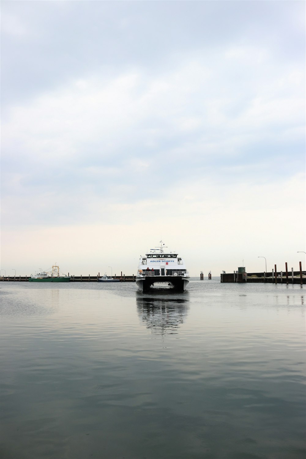 white and black boat on water during daytime