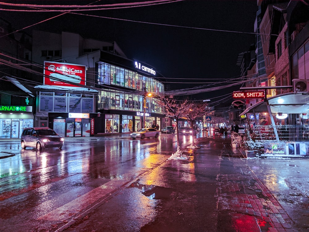 people walking on street during night time