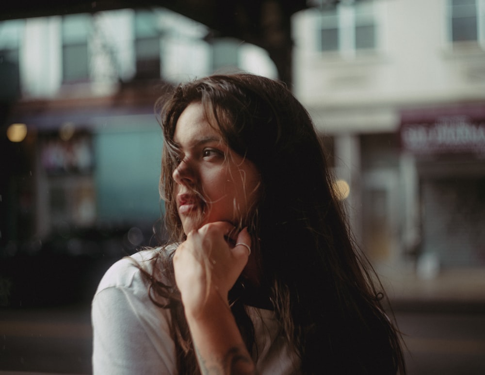 a woman sitting on a bench talking on a cell phone