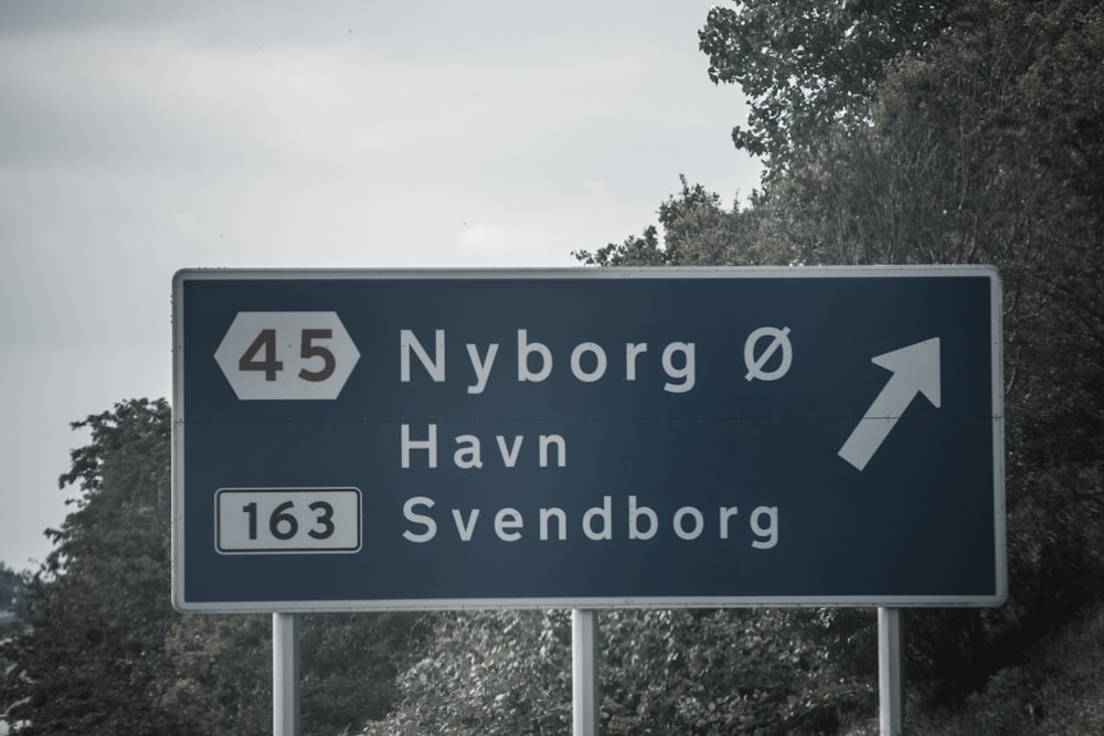 blue and white street sign