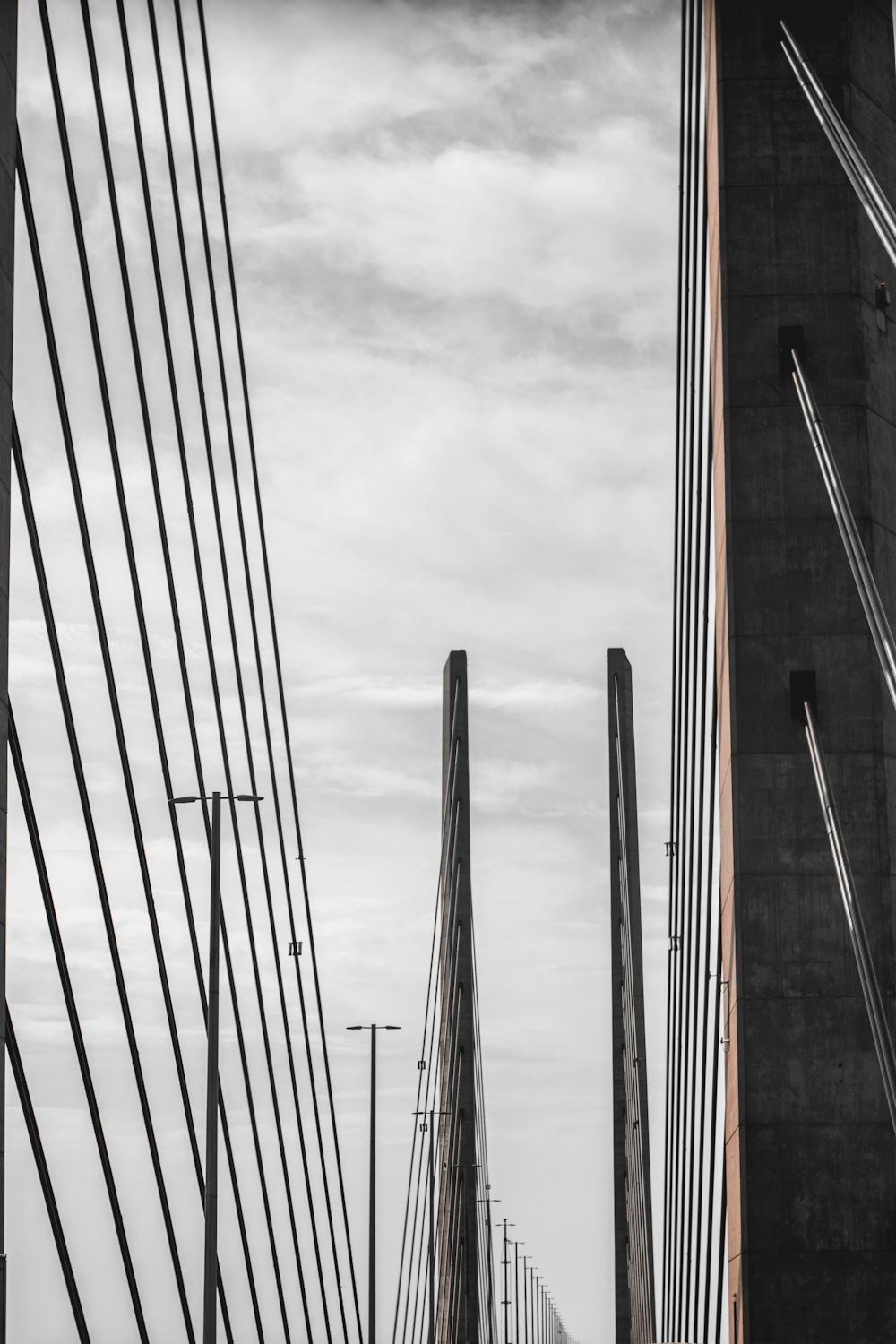 black and orange metal frame under white clouds