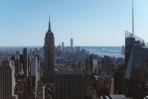 A panoramic view of a city skyline featuring towers.