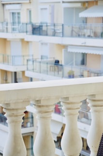 Wide shot of a balcony featuring both glass and stainless steel railings
