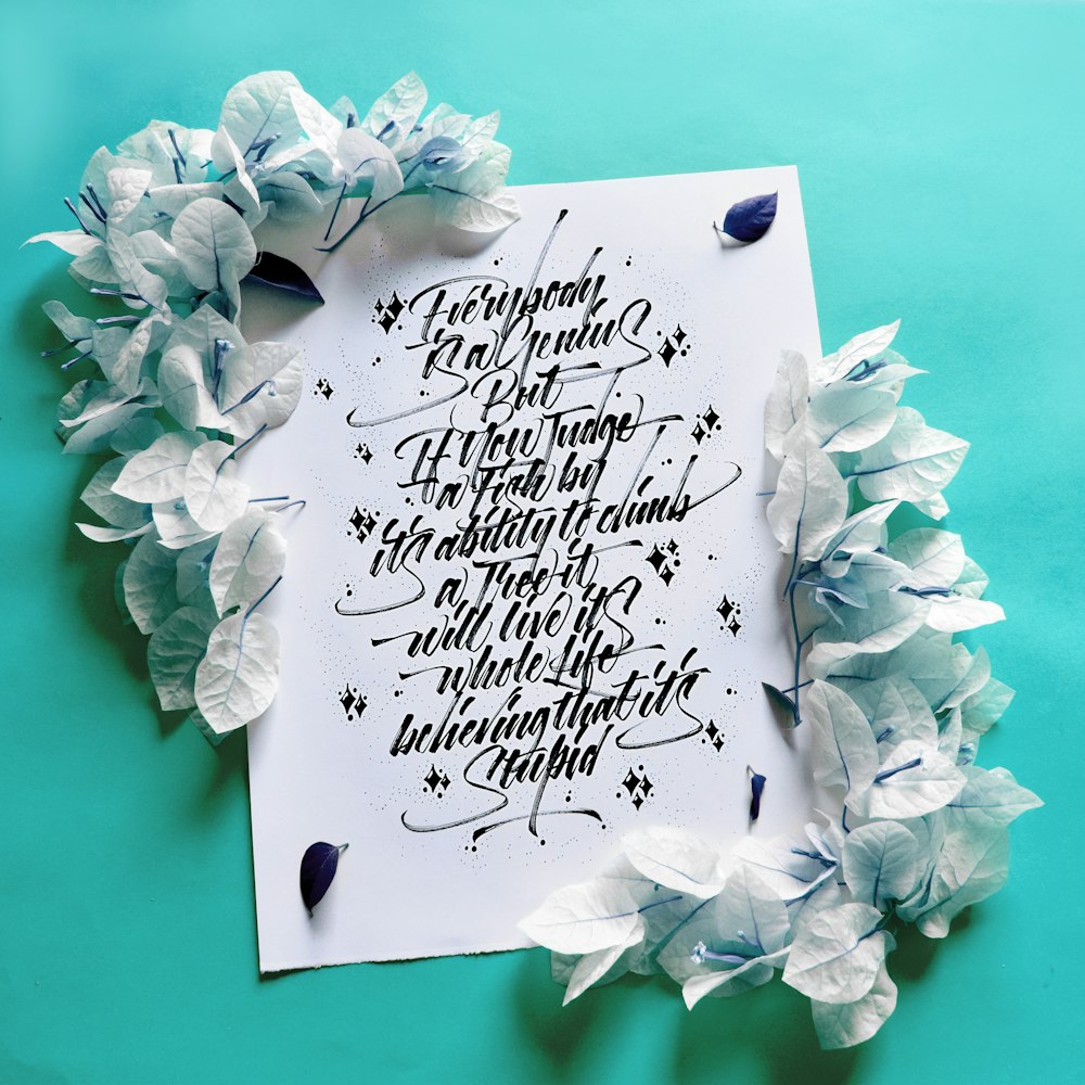 white and black quote on white paper