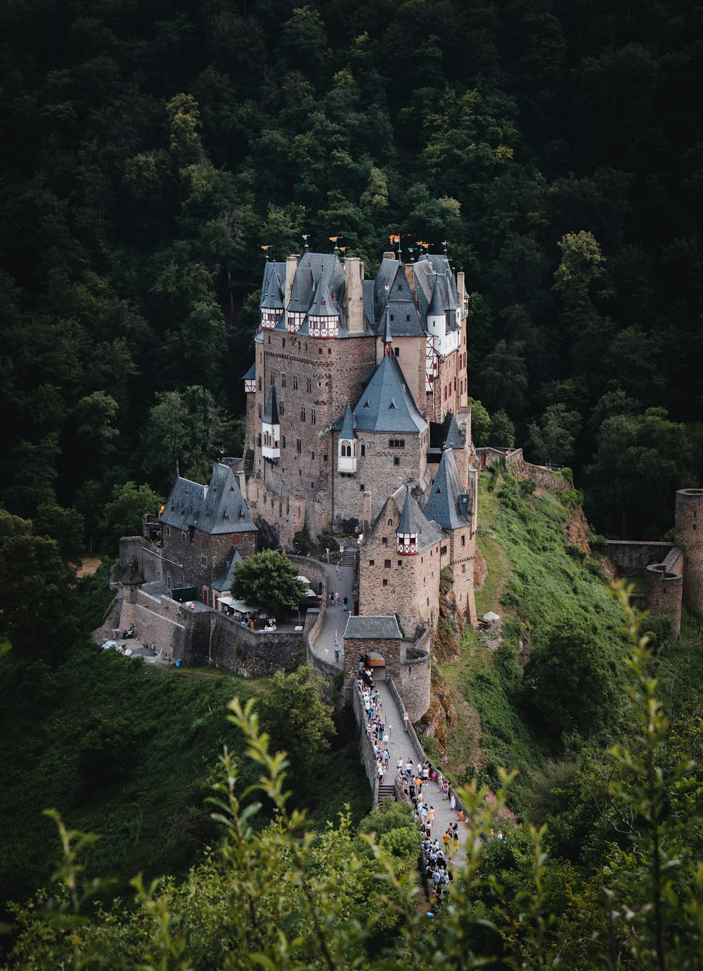 white and gray castle on top of hill