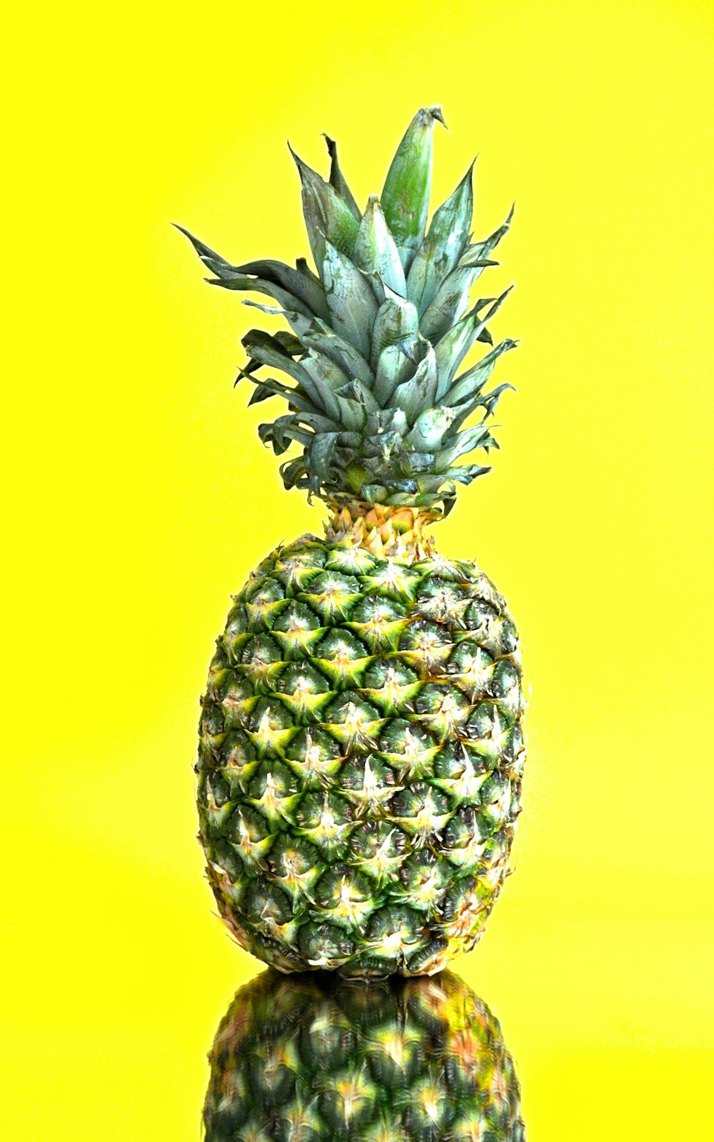 pineapple fruit with yellow background