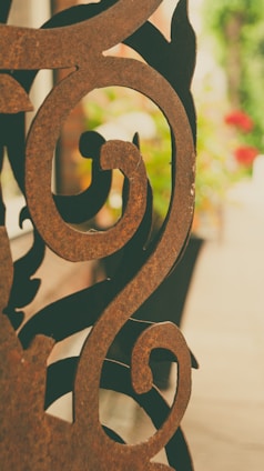 Close-up of a handcrafted metal wall art with intricate patterns and rustic finish