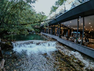 An outdoor view of the restaurant with sustainable architecture blending into nature.