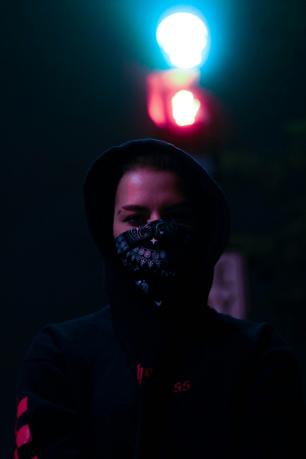 man in black hoodie wearing mask