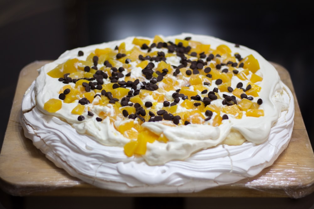 yellow and white cake on white textile