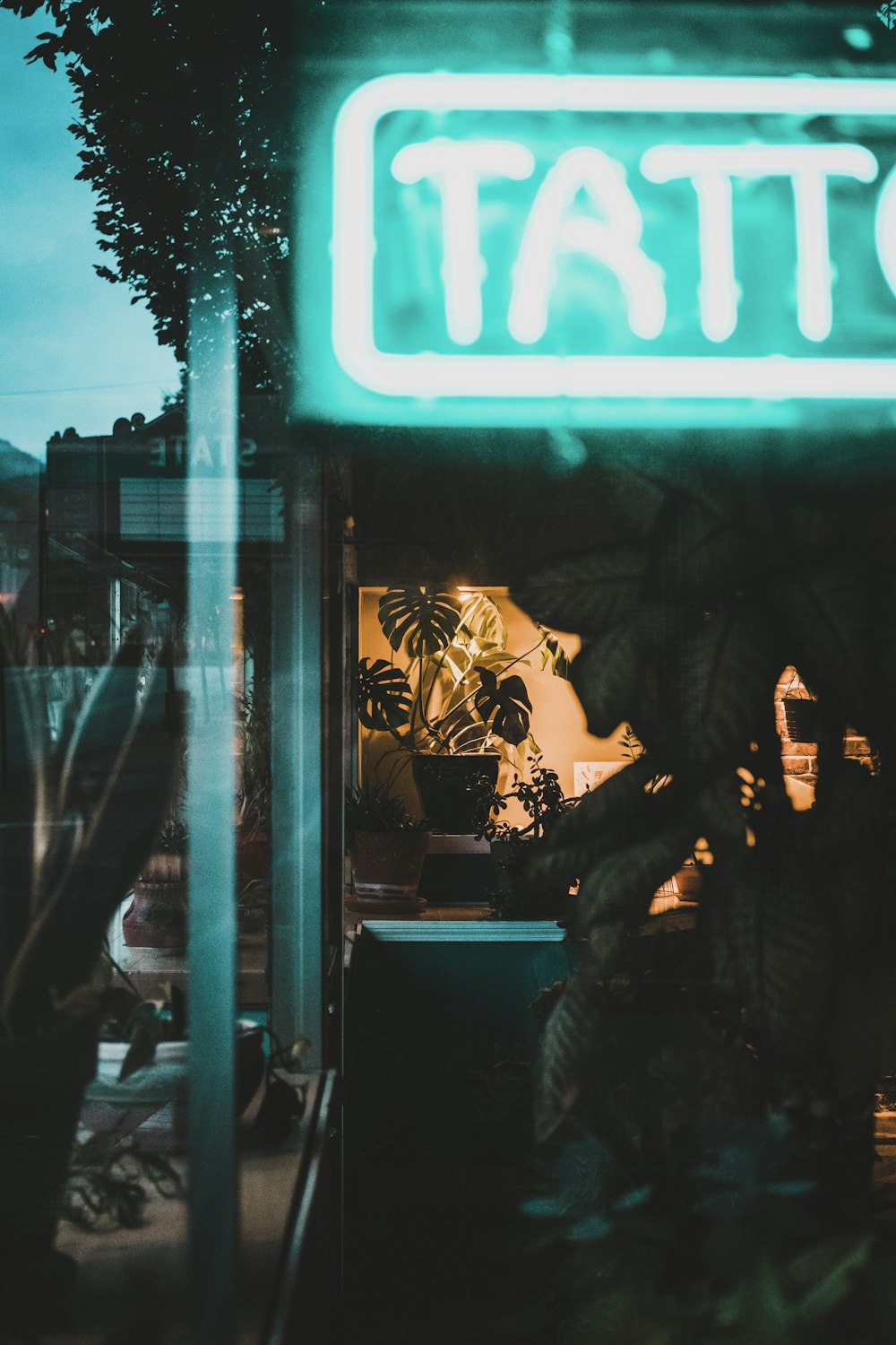 man in black jacket standing near store