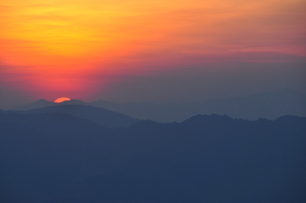 silhouette of mountains during sunset