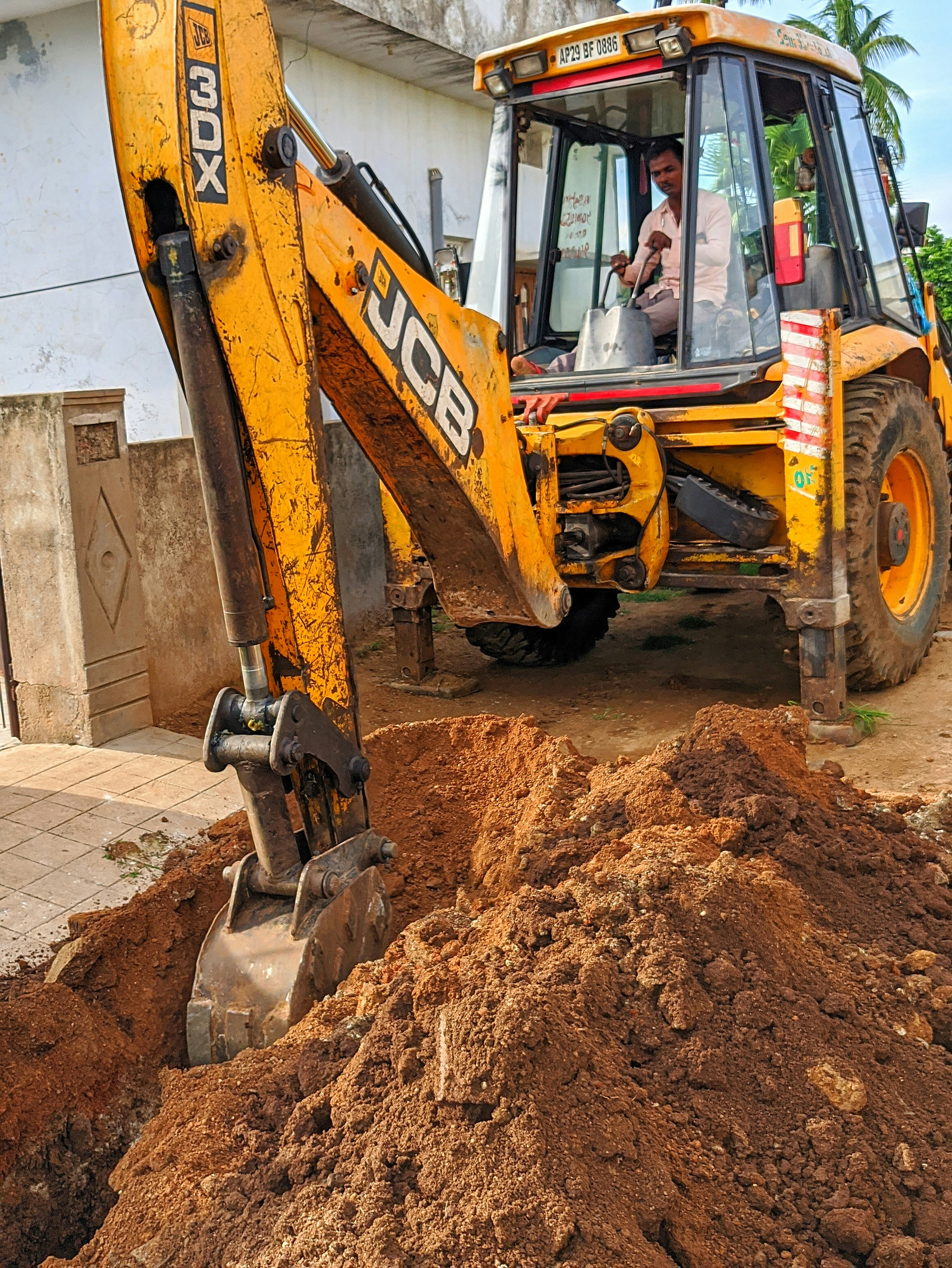 Yellow and black excavator on brown soil photo – Free Person Image on ...