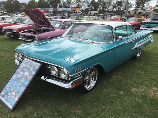 A vintage car showcased at a car event.