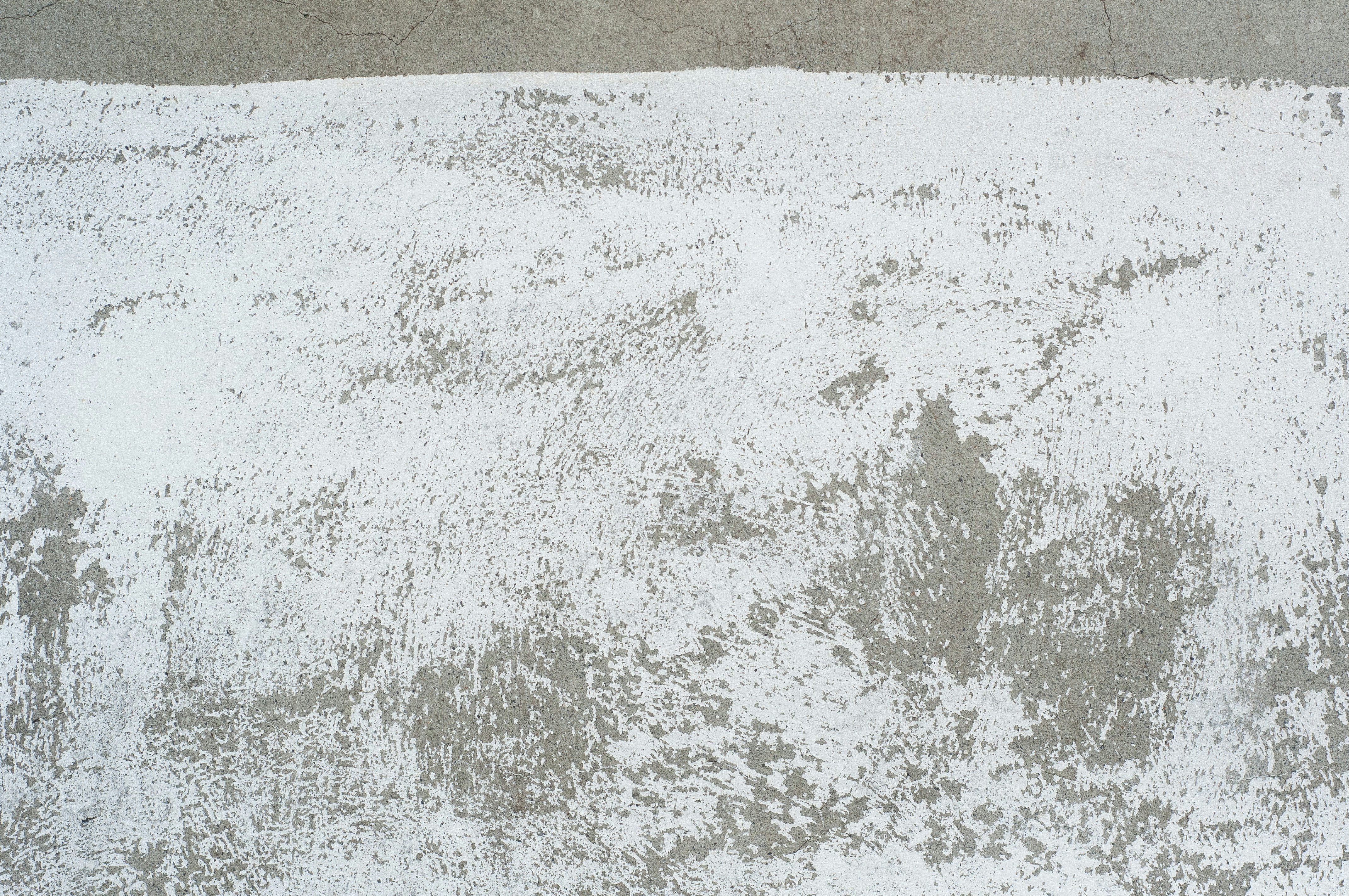 white and brown sand beside body of water