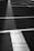 A well-marked parking lot with clear yellow lines and black asphalt.