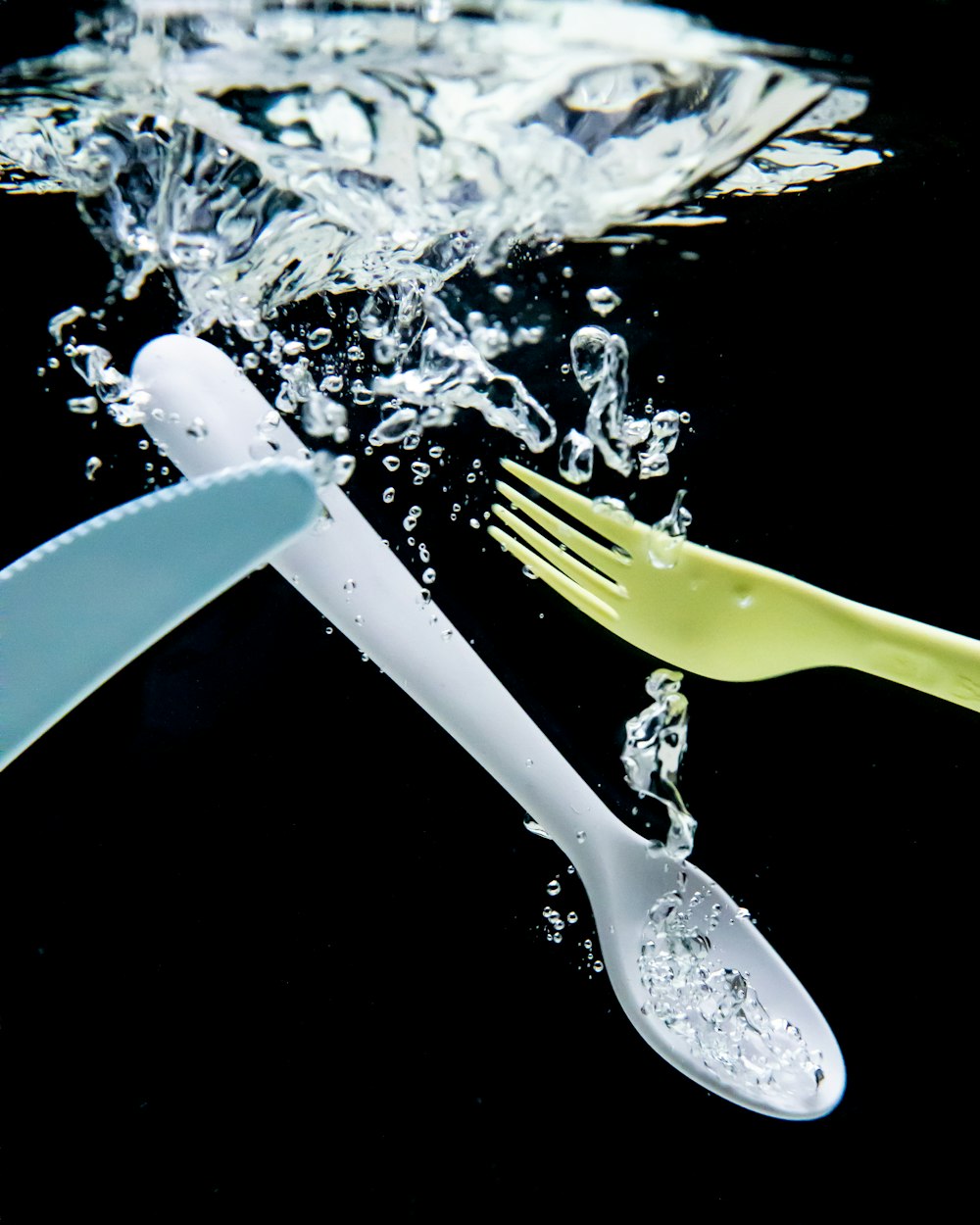 yellow handled fork on white ice