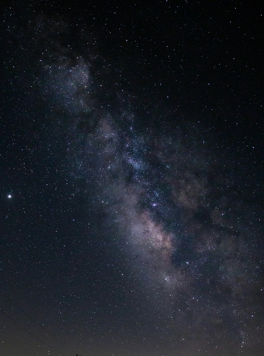 blue and black starry night sky