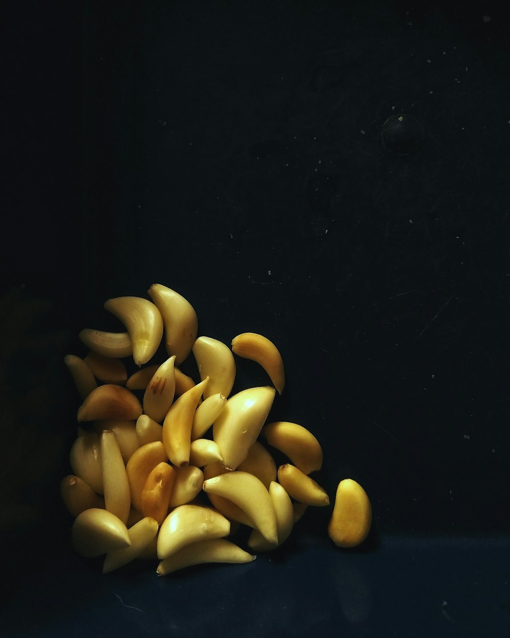 brown nuts on black surface