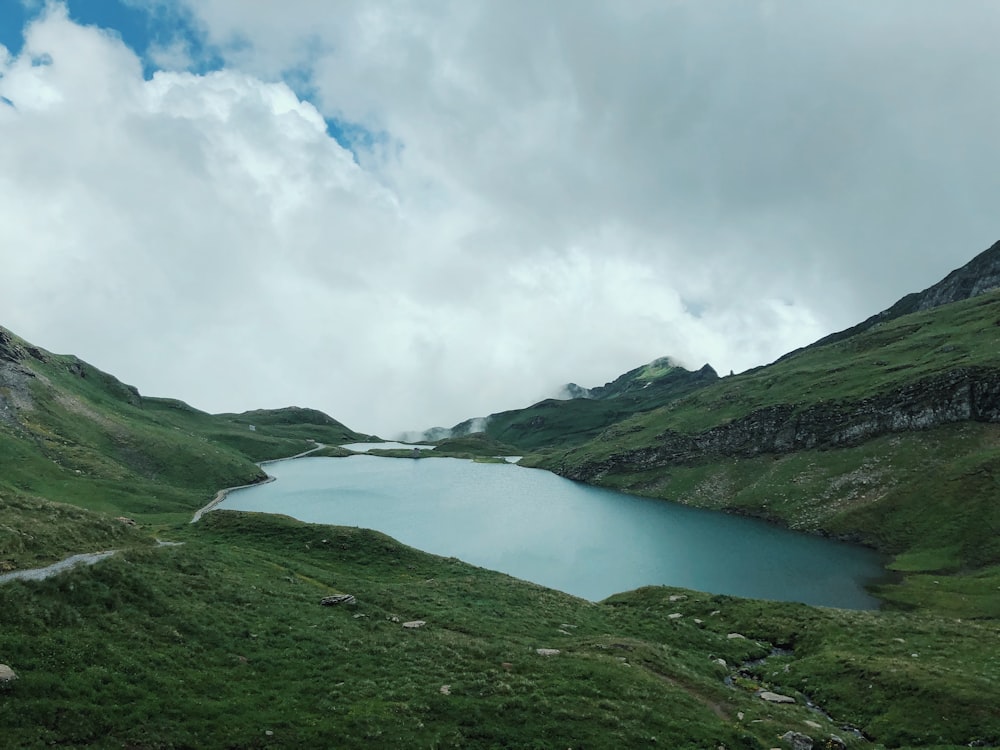 green mountains under white clouds during daytime