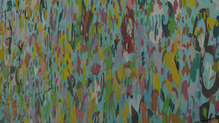 A vibrant mural combining abstract art with human anatomy, symbolizing the fusion of art and physiotherapy.